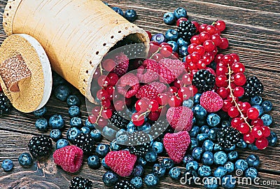 Berries are scattered on the table Stock Photo