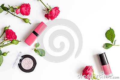 Berry color decorative cosmetics with roses white background top view Stock Photo