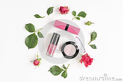 Berry color decorative cosmetics with roses white background top view Stock Photo