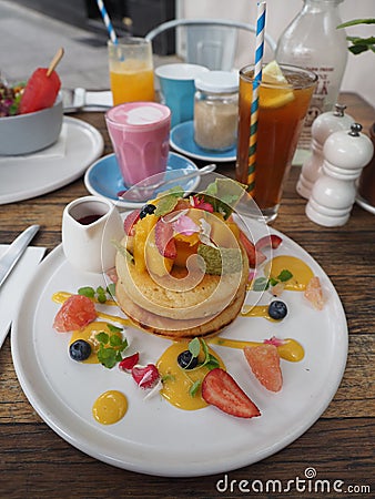 Berry Hotcakes, Iced Lemon Tea, and Beetroots Latte Stock Photo