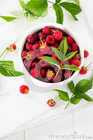 Berry raspberries on the kitchen wooden table. Stock Photo