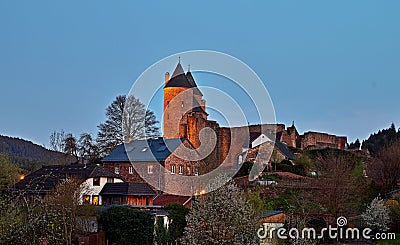 The Bertradaburg is a ruined hill castle on a rock spur, above the village of Muerlenbach in the county of Vulkaneifel Stock Photo