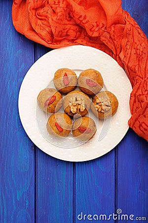 Besan laddu, vegan iIdian sweets with wallnuts and goji berries Stock Photo