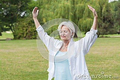 Best ager women practising yoga ant tai chi Stock Photo