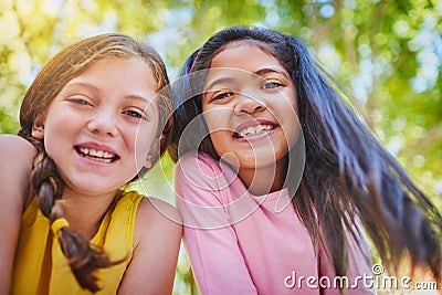 The best friend any girl could ask for. Shot of two adorable young girls outside. Stock Photo