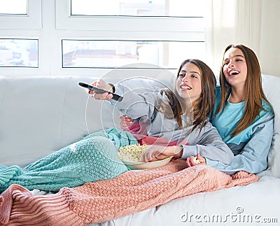 Best friend girls watching TV cinema best friend girls watching Stock Photo