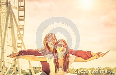 Best friends enjoying time together outdoors at ferris wheel Stock Photo