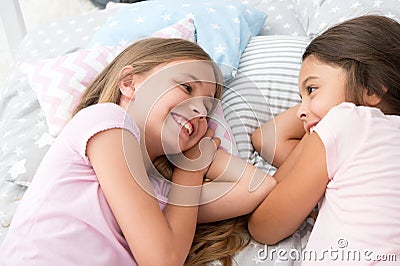 Best friends forever. Girls relaxing on bed. Slumber party concept. Girls just want to have fun. Invite friend for Stock Photo