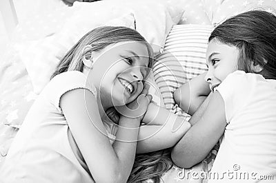 Best friends forever. Girls relaxing on bed. Slumber party concept. Girls just want to have fun. Invite friend for Stock Photo