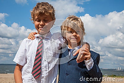 best friends hugging on the beach Stock Photo