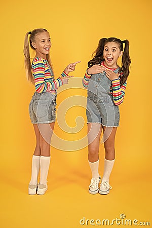 Best friends. Modern fashion. Kids fashion. Little girls wearing rainbow clothes. Happiness. Girls long hair. Cute Stock Photo