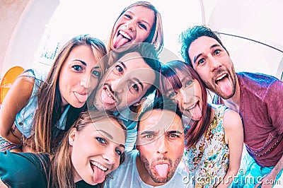 Best friends taking crazy selfie at city tour trip - Happy friendship with millennial students having fun together - Everyday life Stock Photo