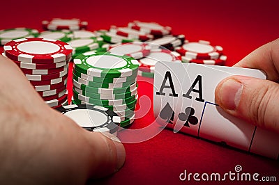 Best gamble in poker or lucky hand concept with player going all in with pocket aces two aces considered the best hand in poker Stock Photo