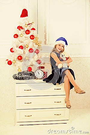 Best gift ever. Excitement replaced with strong feeling satisfaction. Happy new year concept. Kid sit near christmas Stock Photo