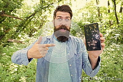 Best GPS and navigation apps. Man bearded wanderer walking in forest with navigation application. Useful software for Stock Photo