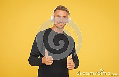 Only the best. music and digital technology. ebook and elearning. unshaven guy in headset listening song. musical app Stock Photo