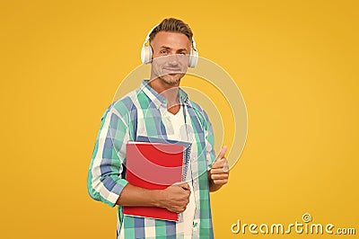 Best online learning platforms to explore. Man listening online lecture. Adult student listen music. Guy wear headphones Stock Photo