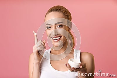 Best skin care product. Woman holding jar of moisturizing cream Stock Photo