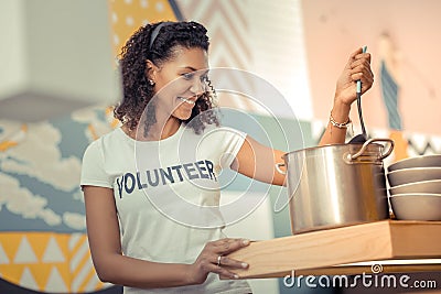 Delighted happy woman cooking in the kitchen Stock Photo