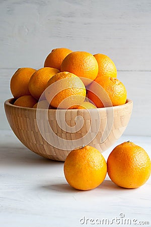 Plain orange mandarins on a grey background Stock Photo