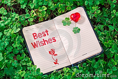 Best wishes text in notebook Stock Photo