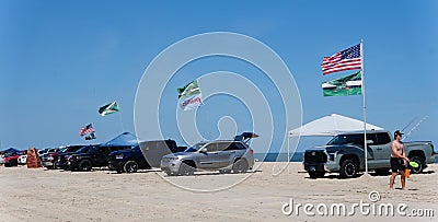 Bethany Beach, Delaware, U.S - July 8, 2023 - The view on the drive-in and trucks parked on the surf fishing beach in the summer Editorial Stock Photo