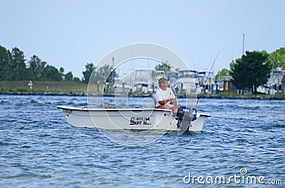 Bethany Beach, Delaware, U.S.A - September 2, 2019 - Angler on the boat fishing for flounder near Indian River Inlet in the summer Editorial Stock Photo