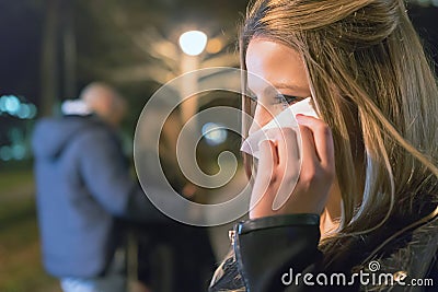 Betrayal. Upset crying girl discovering her boyfriend with another woman Stock Photo