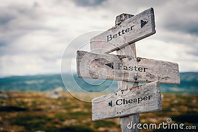 Better, faster, cheaper text on wooden sign post outdoors in landscape scenery. Stock Photo