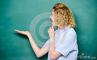 Better than thousand days diligent study is one day with great teacher. Woman teacher in front of chalkboard. Teacher Stock Photo