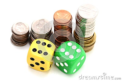 Betting all in concept with ladder of stacked coins and a pair of plastic dice Stock Photo