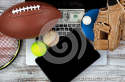 Betting on various sports with computer technology and money in Stock Photo