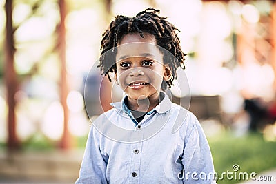 Beutiful black african people children portrait with park outdoor defocused background - color and skin race diversity child Stock Photo