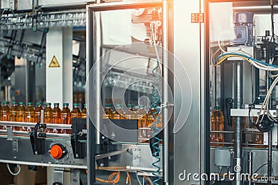 Beverage factory, Conveyor belt with juice in bottles, Industrial Interior, food and drink production line process Stock Photo