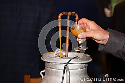 Beverage fountain with punch drink pouring from party event wedding special occasion Stock Photo