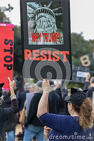 Why Trump? RESIST sign held by protesters Editorial Stock Photo