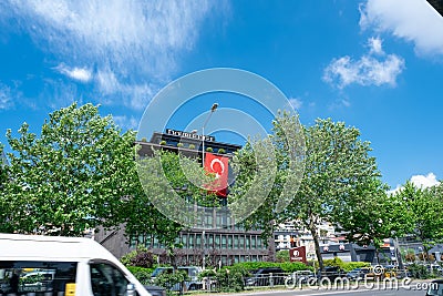 Wide angle view of Double Tree by Hilton hotel building with Turkish flag in Beyoglu district for tourists in Kasimpasa Editorial Stock Photo