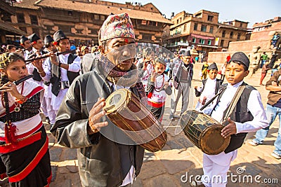BHAKTAPUR, NEPAL - musicians during Birthday celebration head of family Editorial Stock Photo