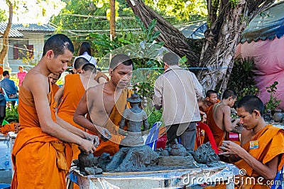 Buddhist young monks in Thailand temple wat doing handcrafts Editorial Stock Photo