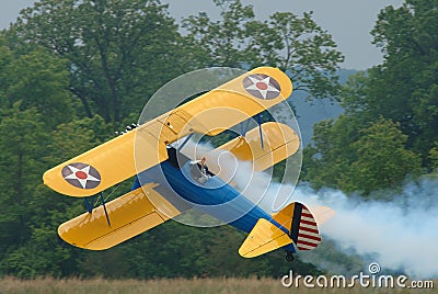 Bi-plane Flying Sideways Stock Photo