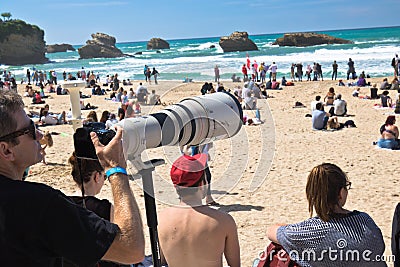 Biarritz, France - May 20, 2017: photographer with photo lens capturing surfers in isa world surfing games competition 2017 in bas Editorial Stock Photo