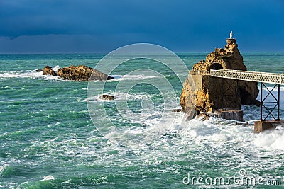 Biarritz`s `Rocher de la Vierge` Rock of the Virgin before the storm Stock Photo