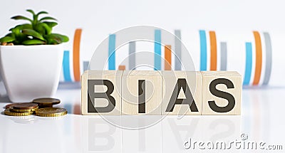 BIAS word letters on the wooden blocks with coins. BUSINESS concept Stock Photo