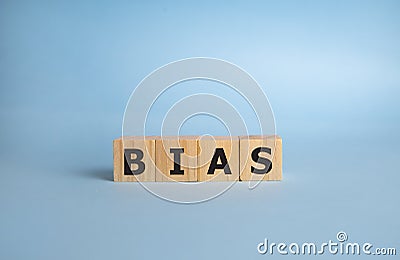 Bias - word from wooden blocks with letters, personal opinions prejudice bias concept, blue background Stock Photo