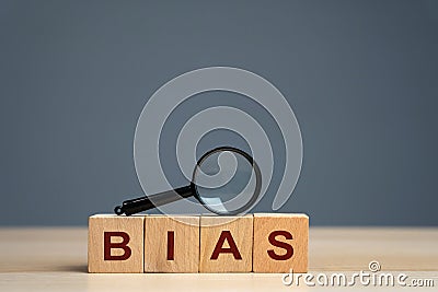 Bias word on a wooden blocks. Prejudice. Personal opinions. Preconception. Concept of facts and biases. Stock Photo