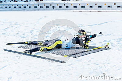 Biathlon lies and shooting target with rifle Stock Photo