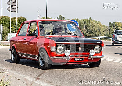 Bibbiano-Reggio Emilia Italy - 07 15 2015 : Free rally of vintage cars in the town square Fiat 128 Rally Editorial Stock Photo