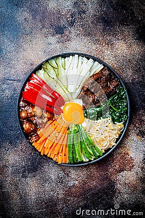 Bibimbap, traditional Korean dish, rice with vegetables and beef. Stock Photo