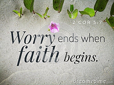 Worry ends when faith begins with bible verse design for Christianity with sandy beach background. Stock Photo