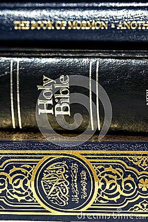 Bible and Koran (Qur'an) and Book of Mormon Stock Photo